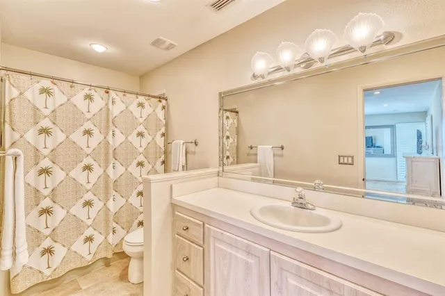 a bathroom with a sink double vanity and a mirror