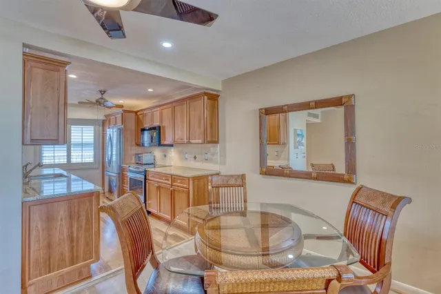 a dining room with furniture and window
