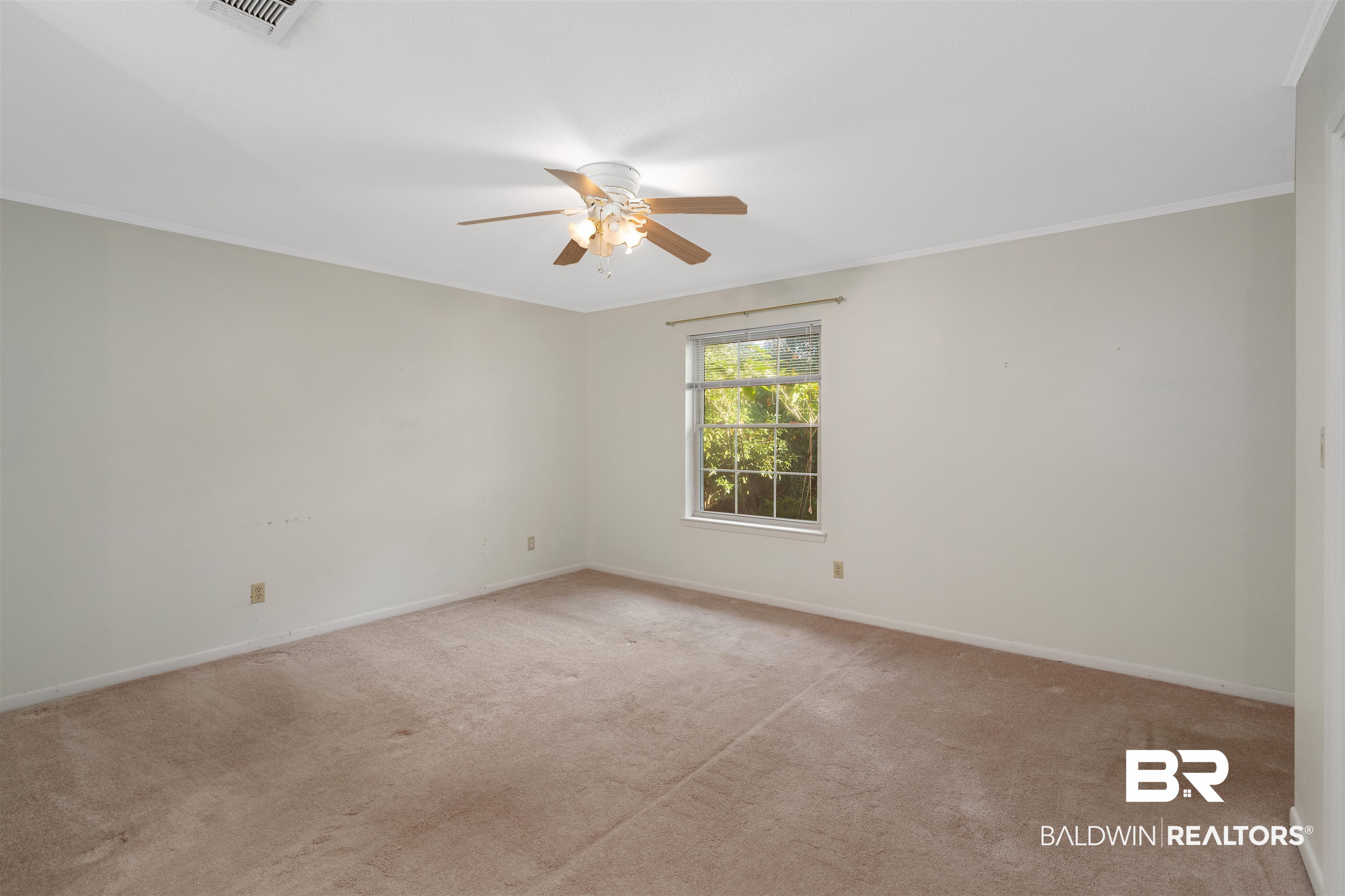 621 Spanish Main Spanish Fort, AL 36527 - Photo 23 of 29 Empty room with ceiling fan, ornamental molding, and light carpet