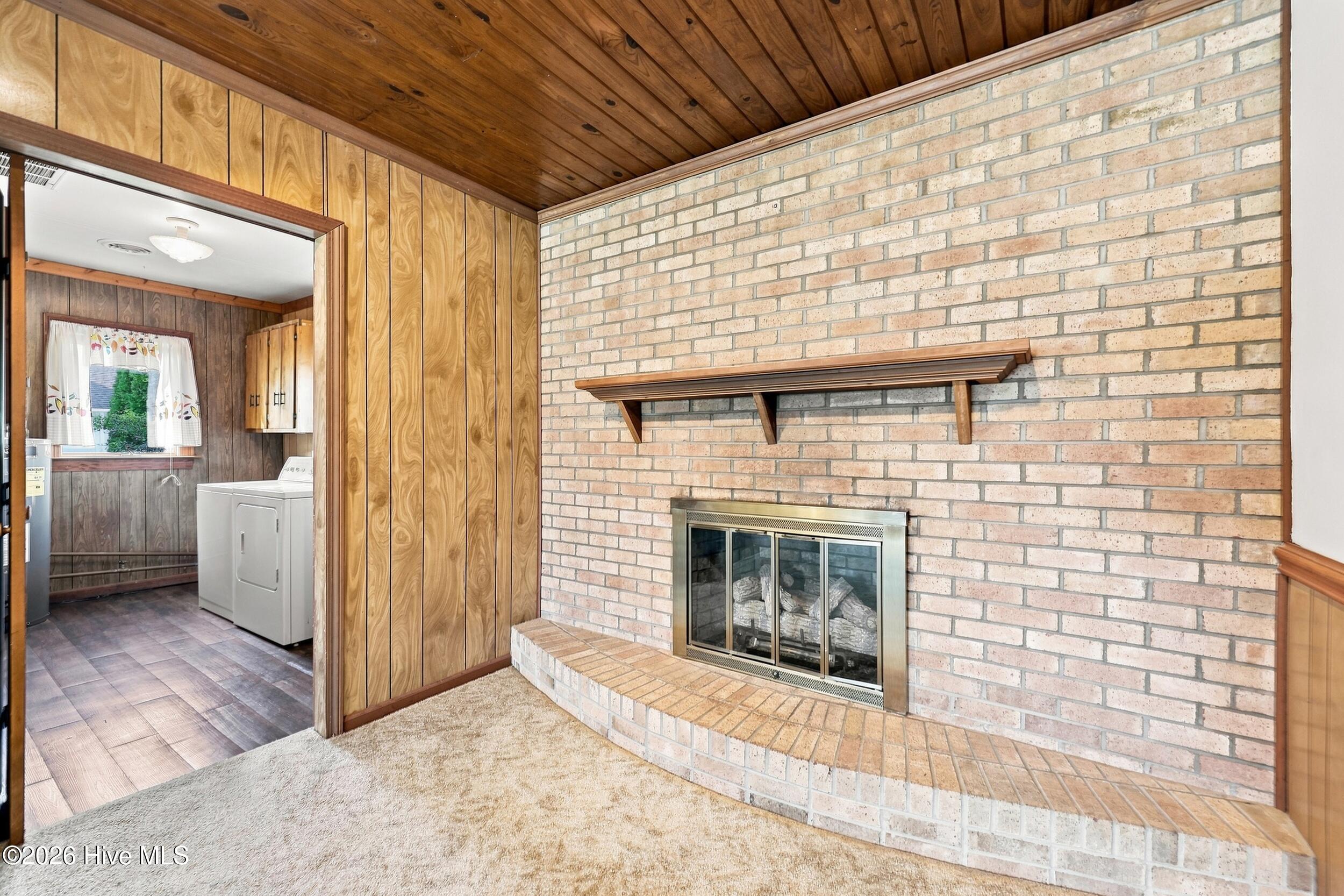 507 Narrow Shore Road Aydlett, NC 27916 - Photo 11 of 39 507 close up of fireplace and utility ro