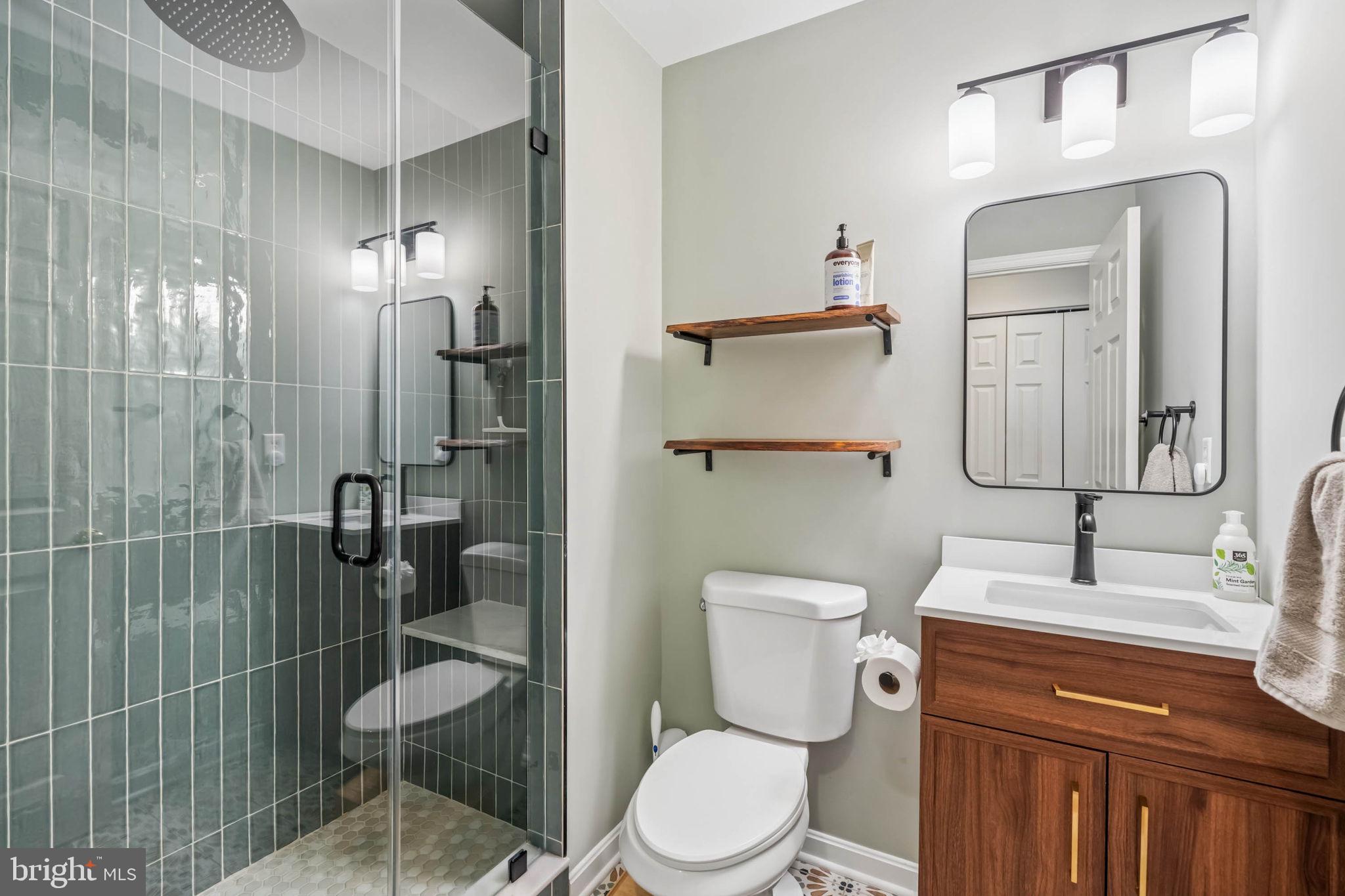 3005 Keswick Road Baltimore, MD 21211 - Photo 28 of 46 Renovated primary bath with glass-enclosed shower