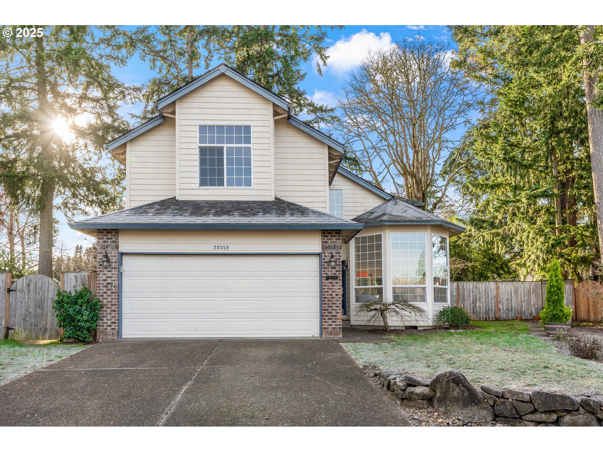 20259 Southwest Celebrity Street Beaverton, OR 97078 - Photo 1 of 40 a front view of a house with a yard and garage