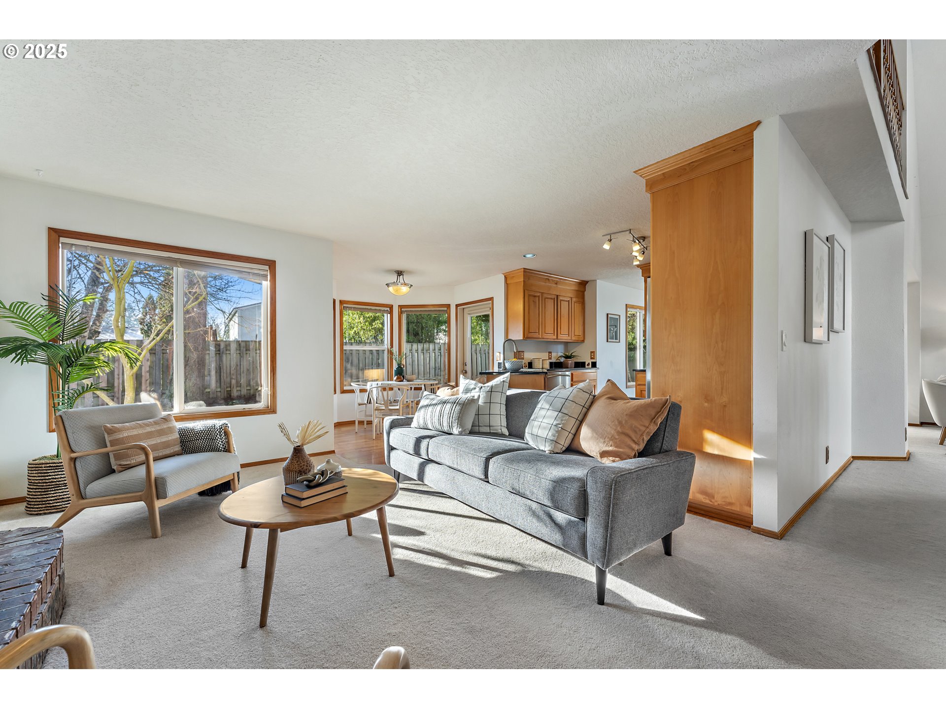 20259 Southwest Celebrity Street Beaverton, OR 97078 - Photo 13 of 40 a living room with furniture and a large window