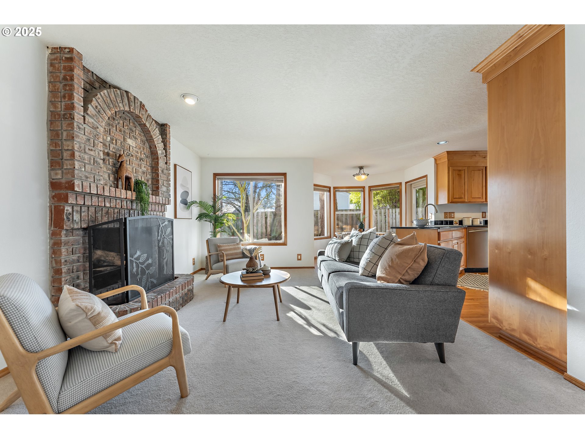 20259 Southwest Celebrity Street Beaverton, OR 97078 - Photo 14 of 40 a living room with furniture and a fireplace