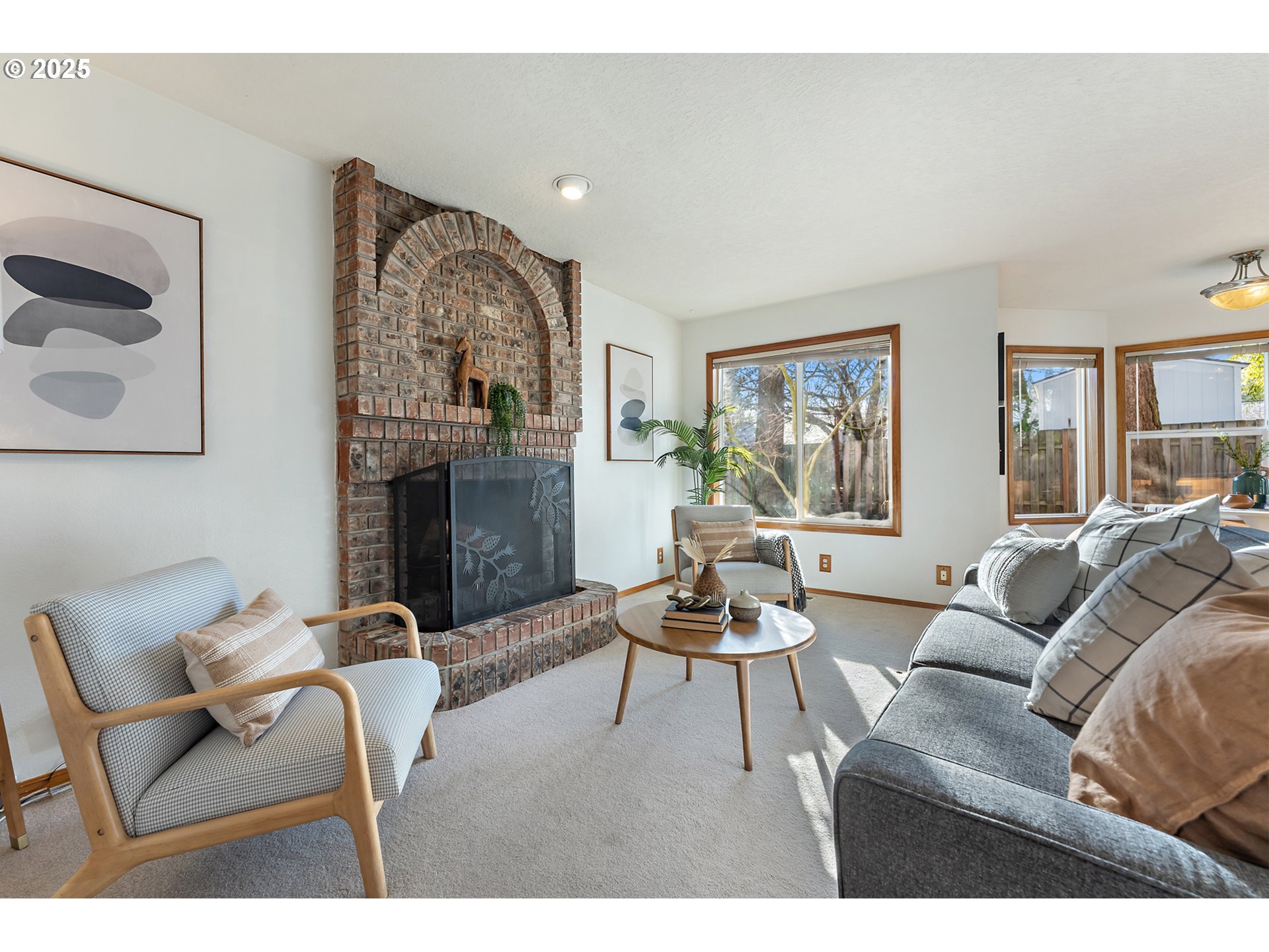 20259 Southwest Celebrity Street Beaverton, OR 97078 - Photo 15 of 40 a living room with furniture and a fireplace