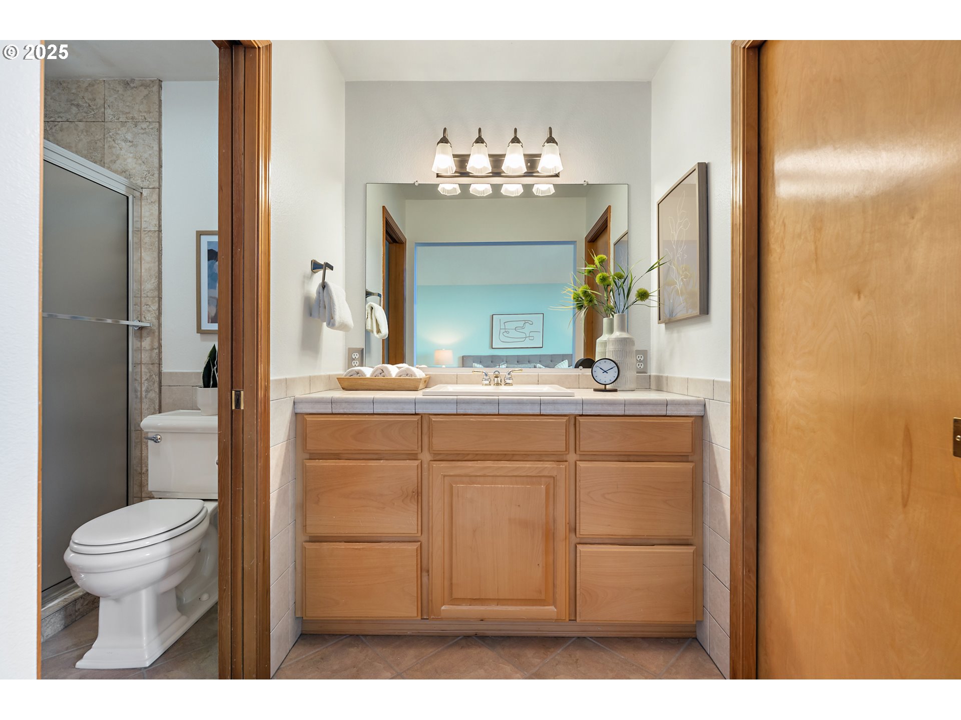 20259 Southwest Celebrity Street Beaverton, OR 97078 - Photo 20 of 40 a bathroom with a sink vanity mirror and toilet