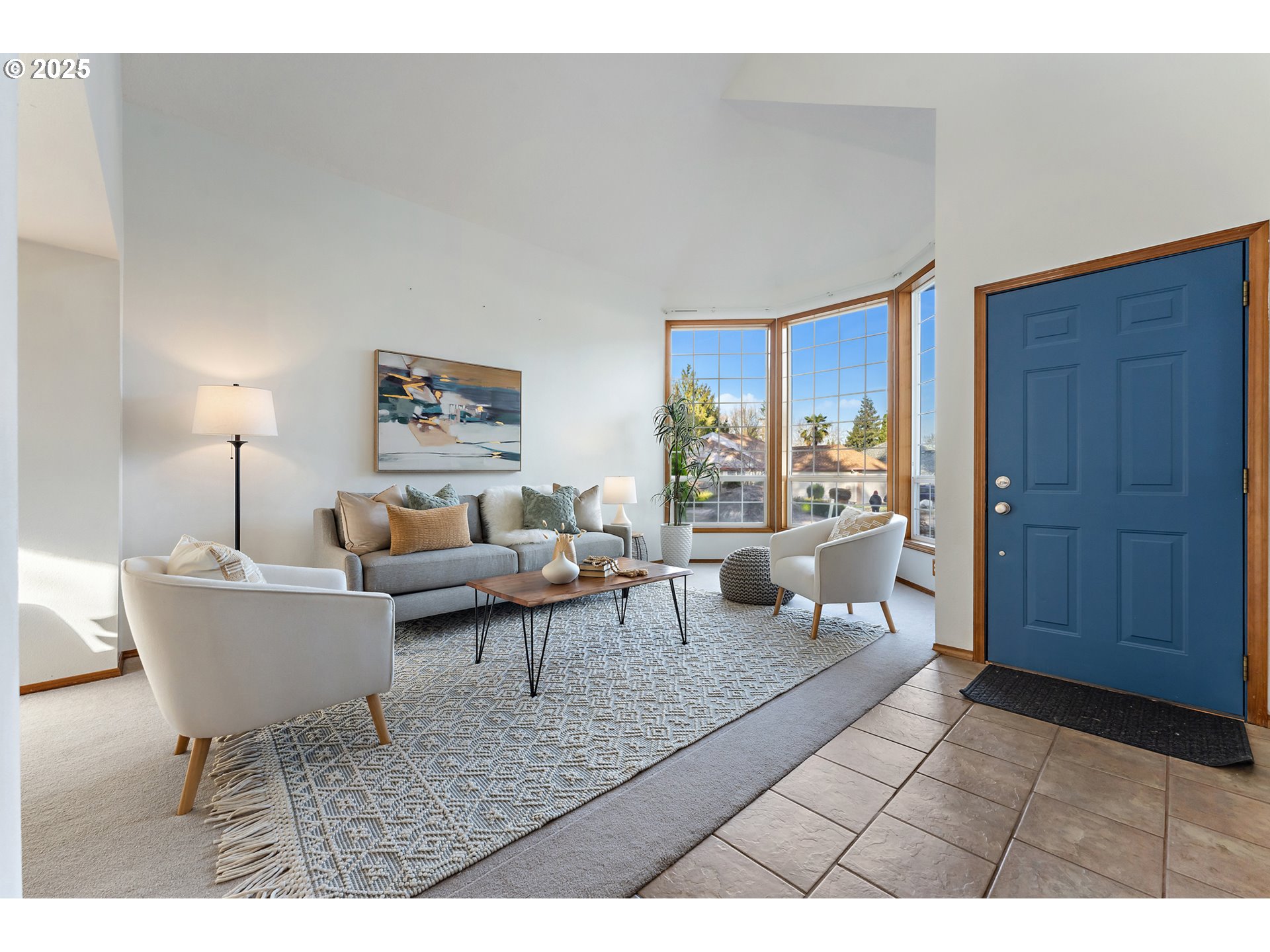 20259 Southwest Celebrity Street Beaverton, OR 97078 - Photo 2 of 40 a living room with furniture a lamp a rug and a window