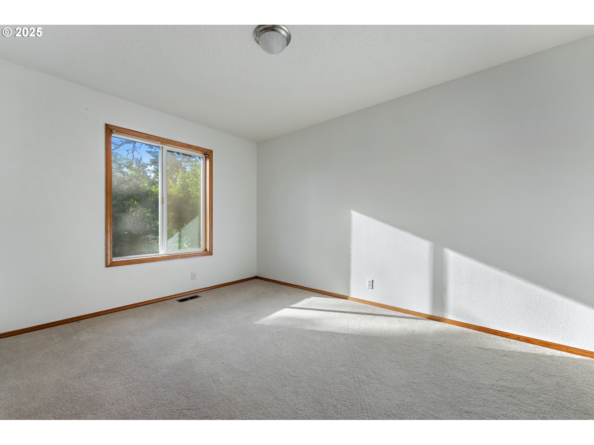 20259 Southwest Celebrity Street Beaverton, OR 97078 - Photo 24 of 40 a view of an empty room with a window