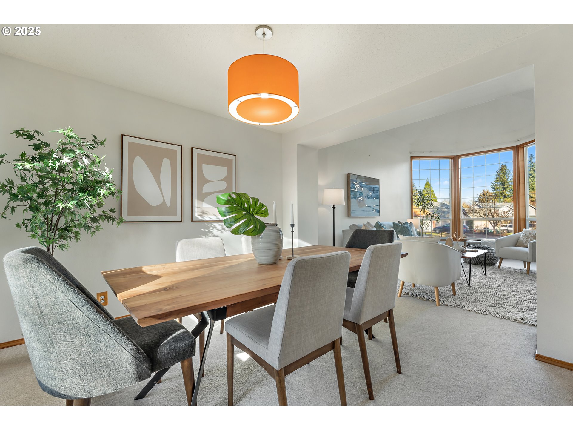 20259 Southwest Celebrity Street Beaverton, OR 97078 - Photo 5 of 40 a view of a dining room with furniture and a potted plant