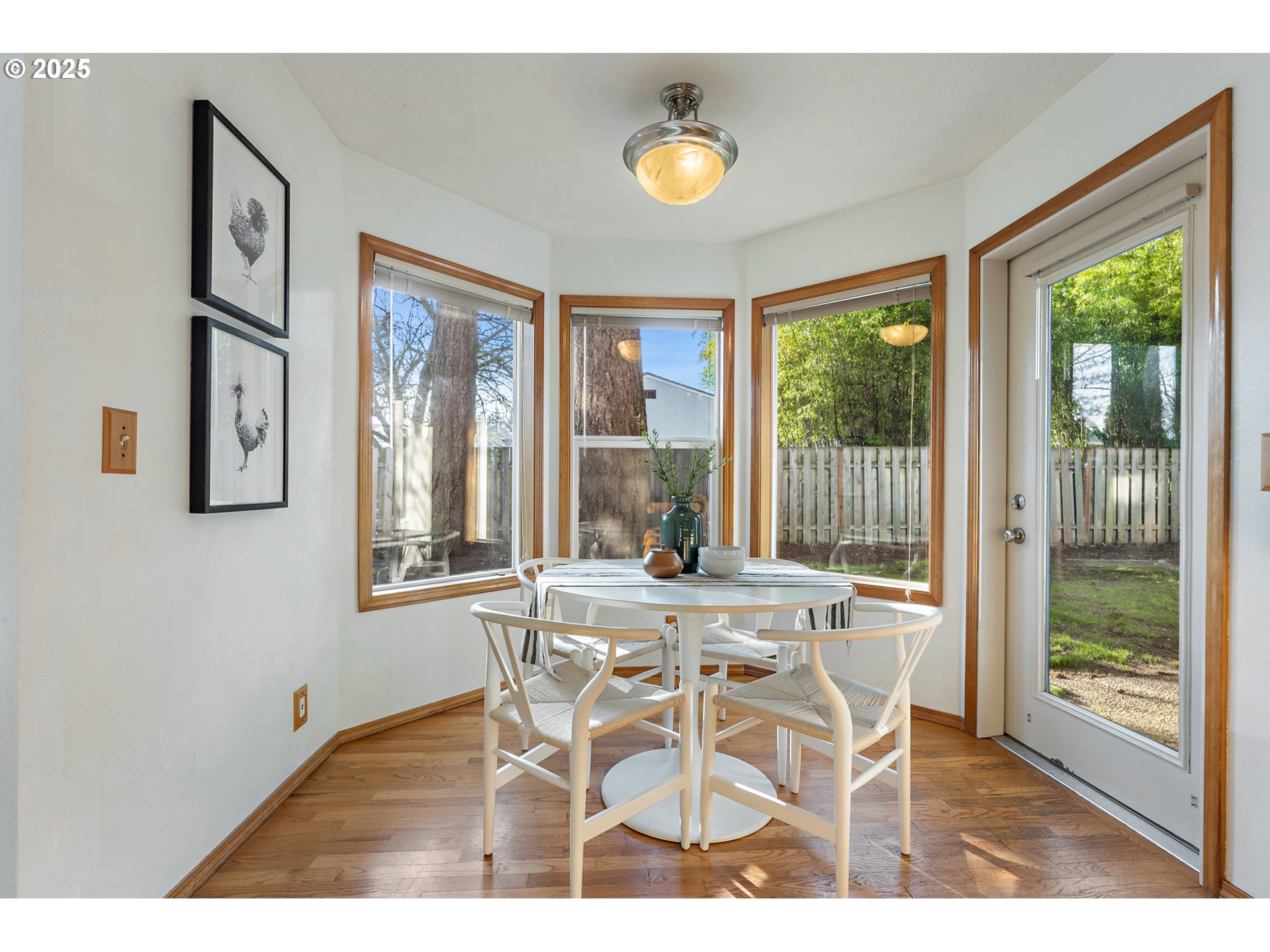 20259 Southwest Celebrity Street Beaverton, OR 97078 - Photo 8 of 40 a view of a dining room with furniture and windows