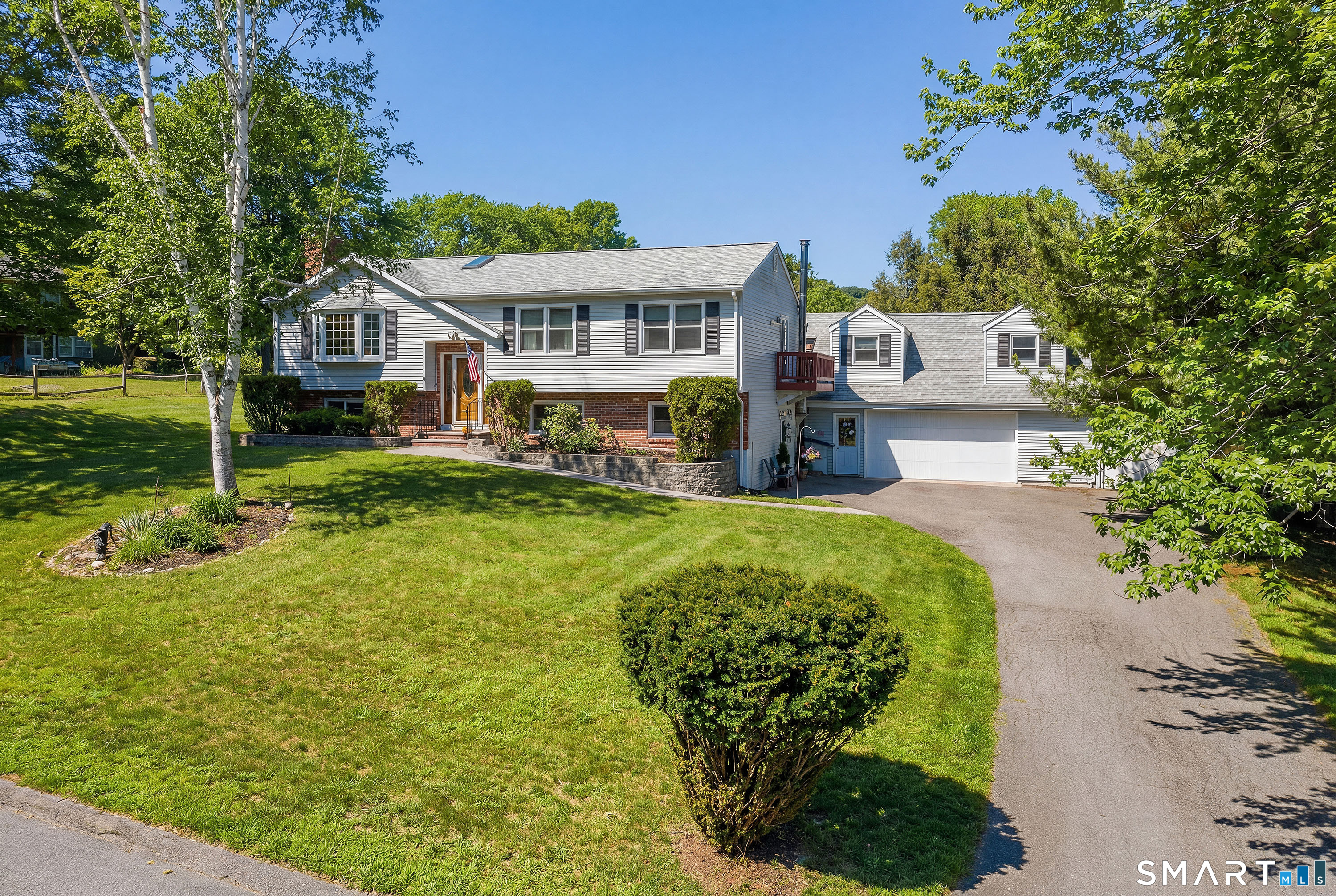 27 Jotham Road New Milford, CT 06776 - Photo 1 of 37 a front view of a house with a yard table and chairs
