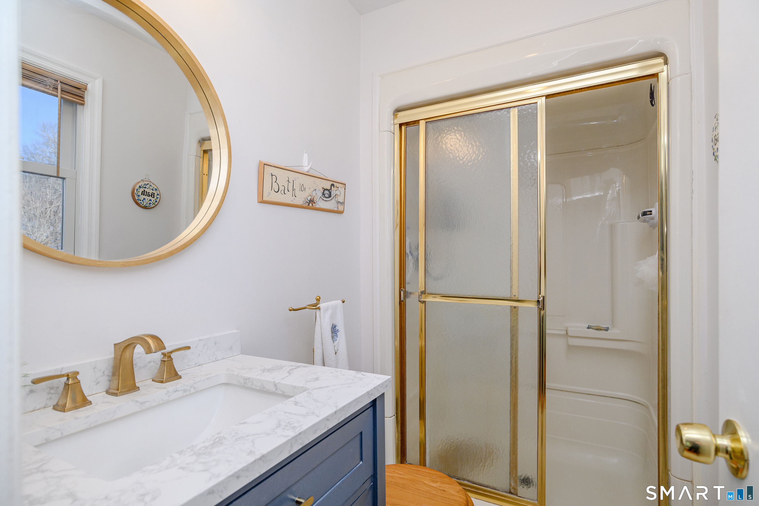 27 Jotham Road New Milford, CT 06776 - Photo 12 of 37 a bathroom with a sink and a mirror