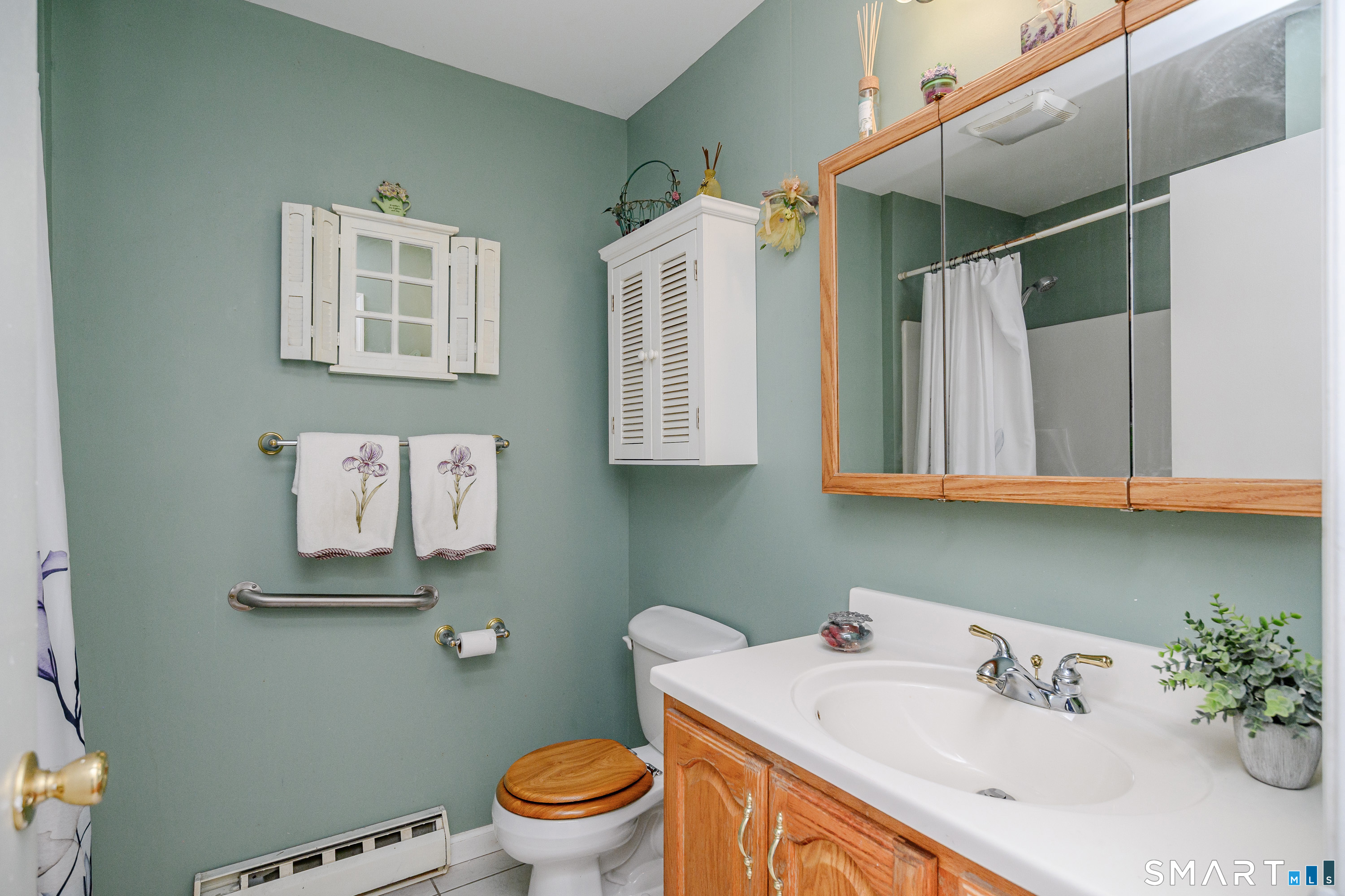 27 Jotham Road New Milford, CT 06776 - Photo 15 of 37 a bathroom with a sink a toilet and mirror