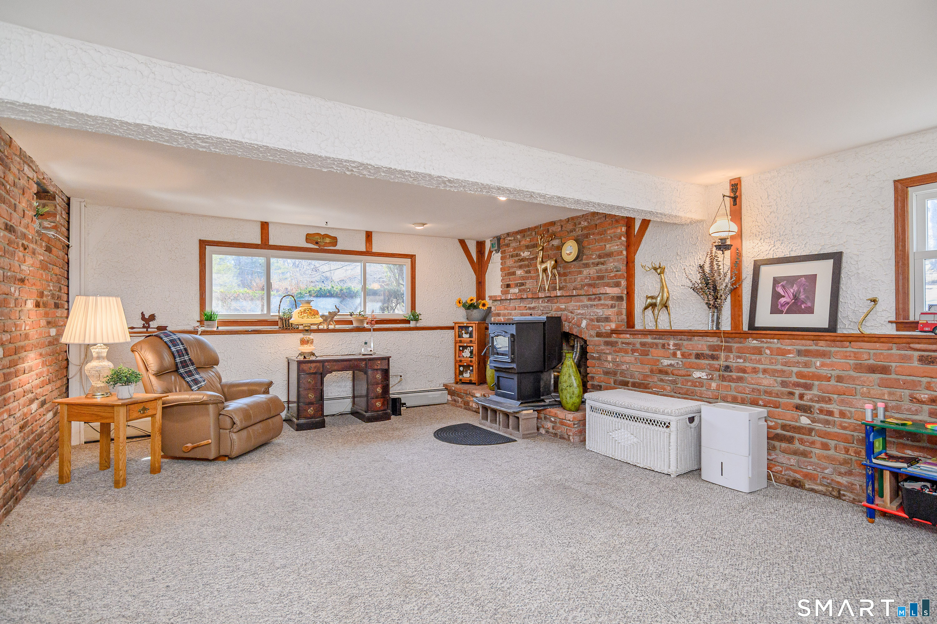 27 Jotham Road New Milford, CT 06776 - Photo 16 of 37 a living room with furniture and a flat screen tv