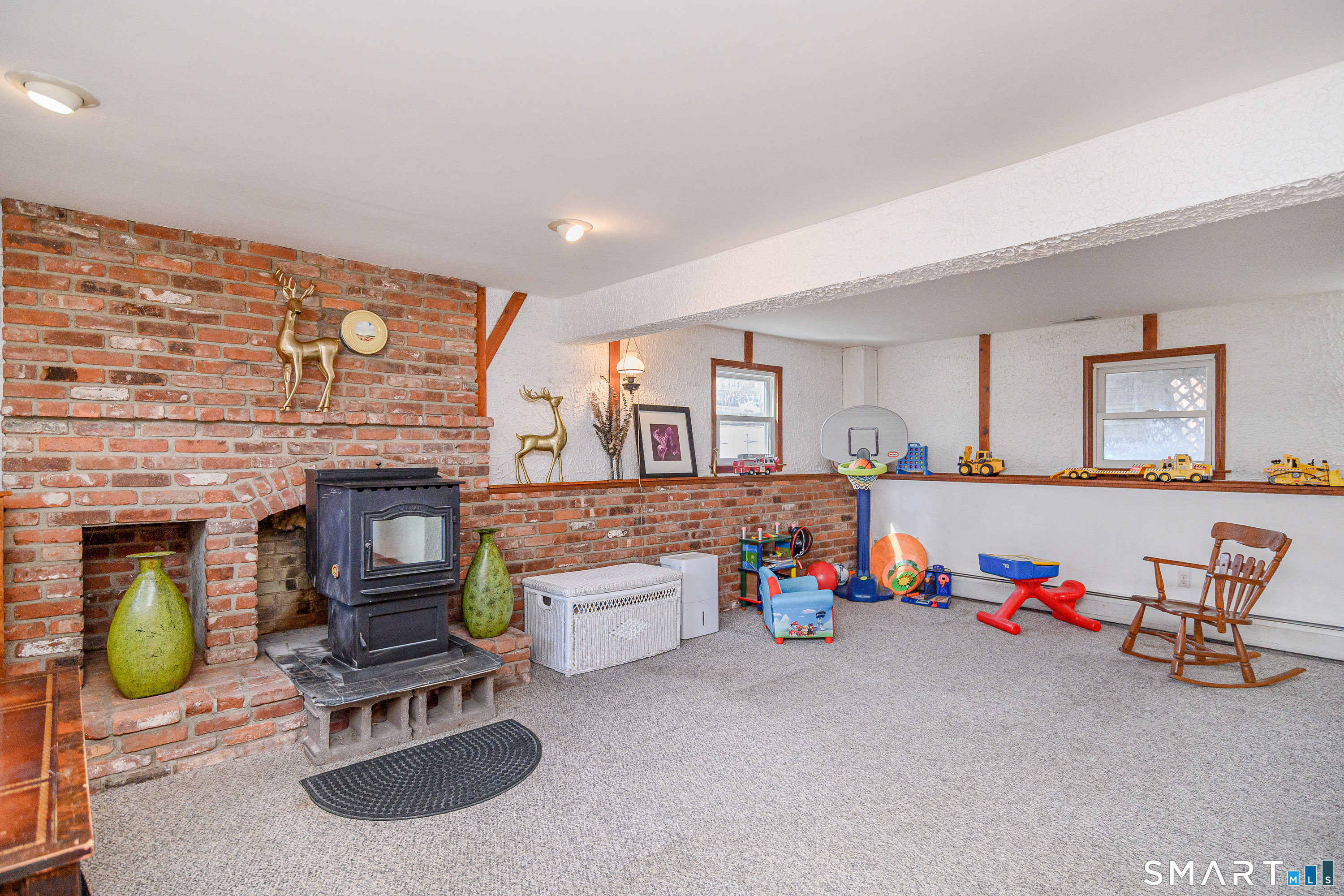 27 Jotham Road New Milford, CT 06776 - Photo 19 of 37 a living room with furniture and kitchen view