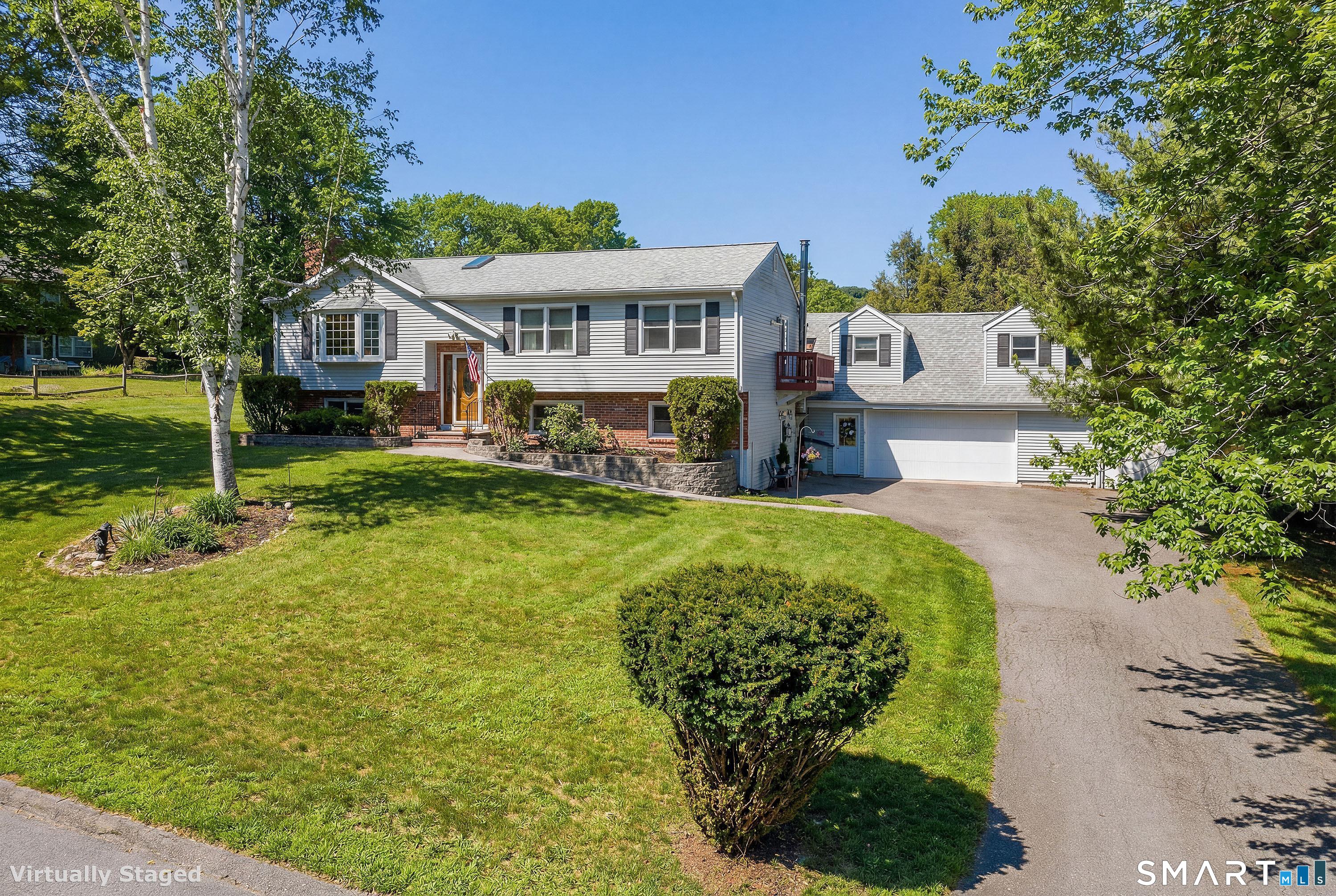 27 Jotham Road New Milford, CT 06776 - Photo 2 of 37 a front view of a house with a yard table and chairs