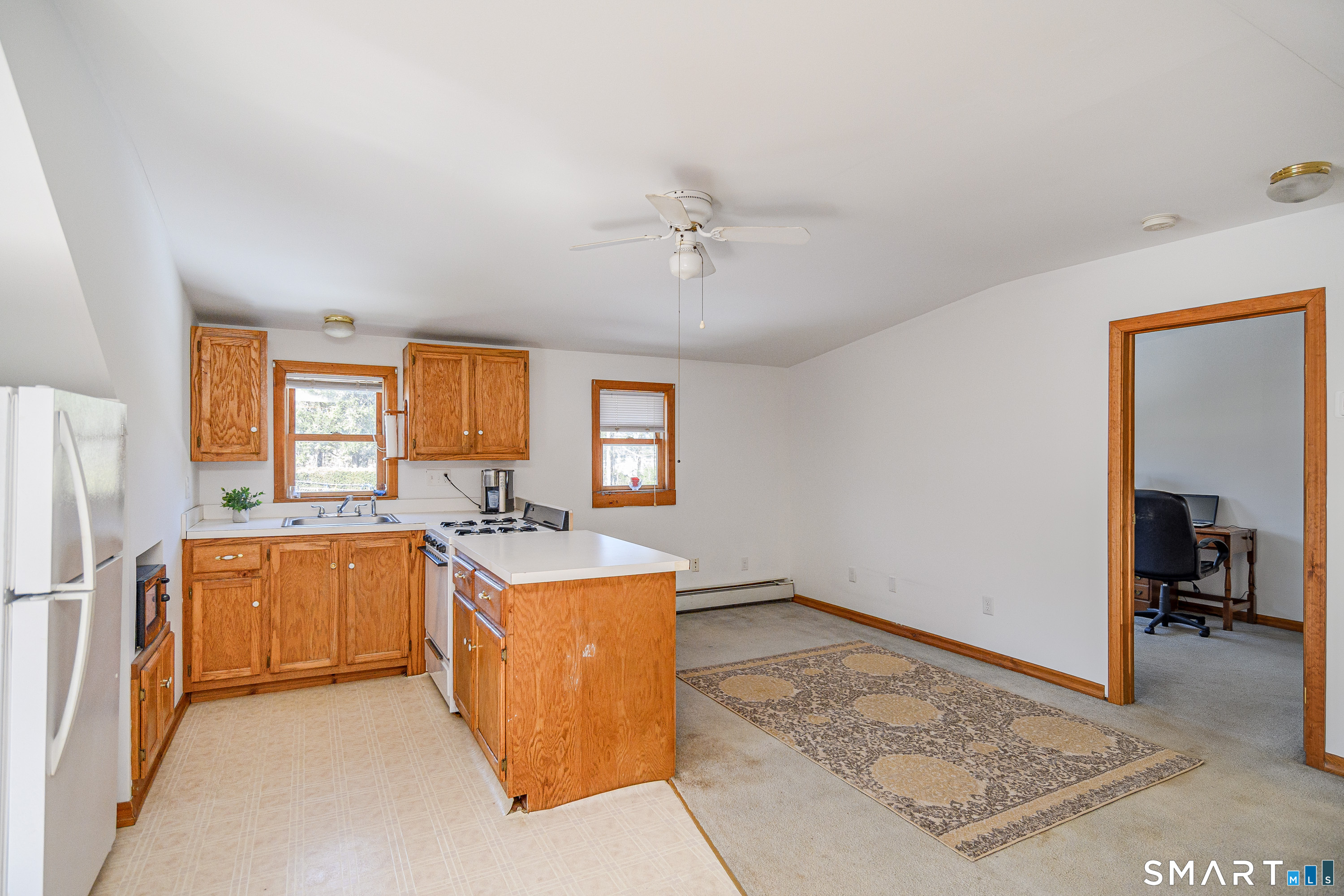 27 Jotham Road New Milford, CT 06776 - Photo 23 of 37 a kitchen with a stove a refrigerator and a stove top oven