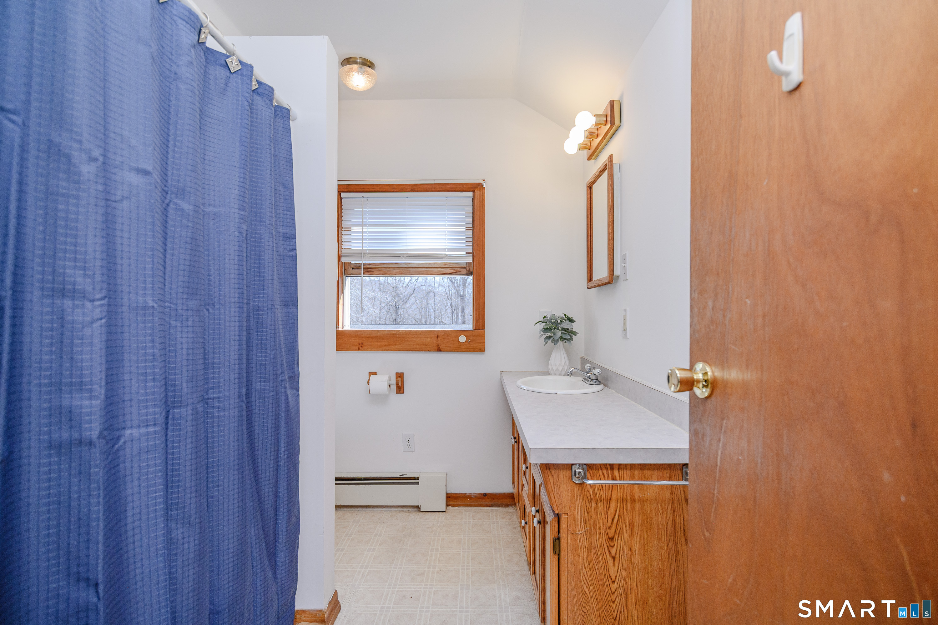 27 Jotham Road New Milford, CT 06776 - Photo 32 of 37 a bathroom with a sink and a mirror