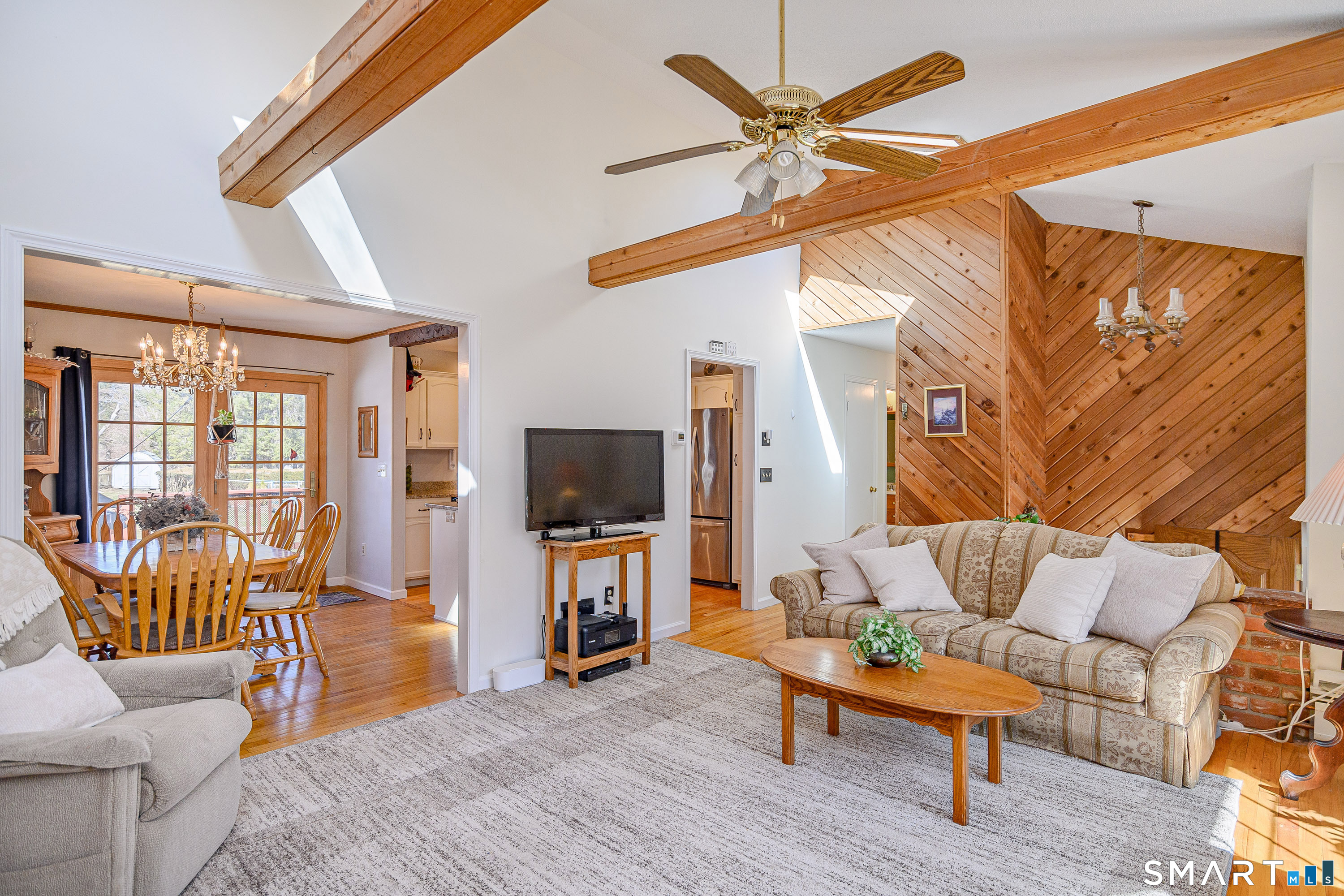 27 Jotham Road New Milford, CT 06776 - Photo 7 of 37 a living room with furniture and a flat screen tv