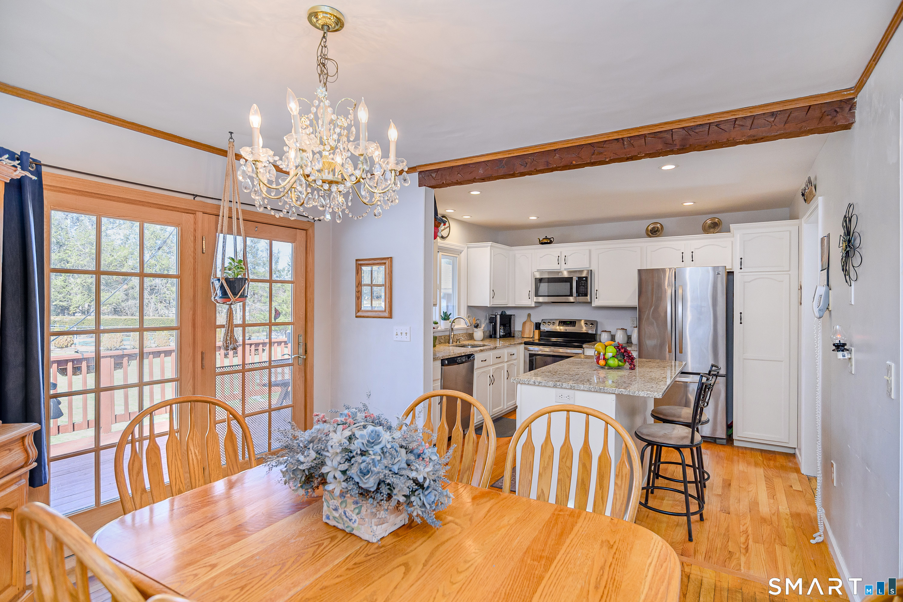 27 Jotham Road New Milford, CT 06776 - Photo 8 of 37 a dining room with furniture a chandelier and wooden floor