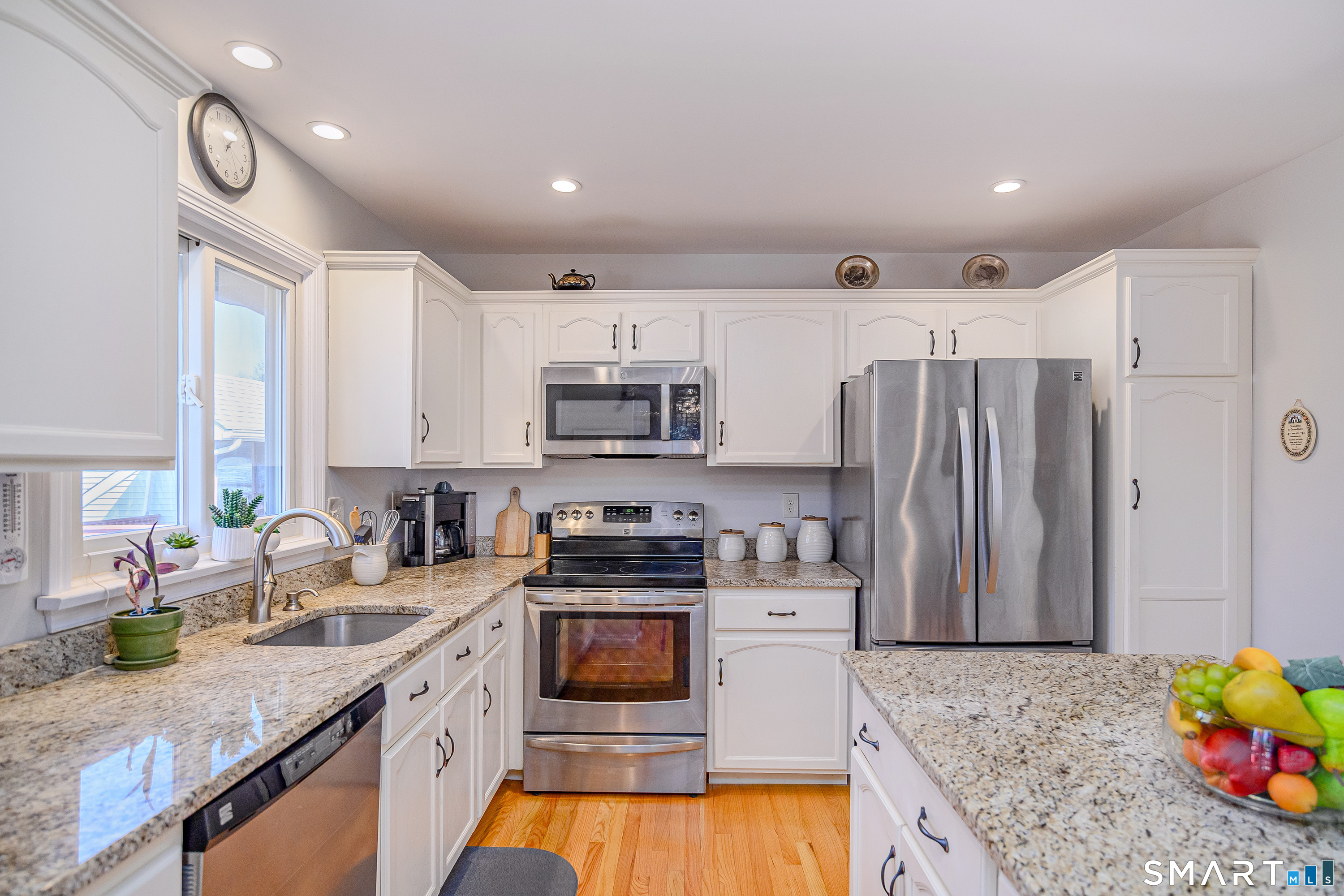 27 Jotham Road New Milford, CT 06776 - Photo 9 of 37 a kitchen with stainless steel appliances granite countertop a sink stove and refrigerator