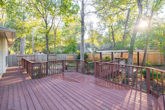 a view of wooden deck with furniture