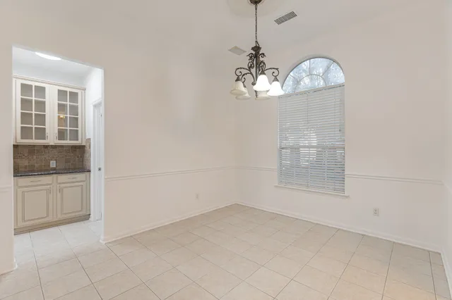 a view of a kitchen with a dishwasher cabinets and window