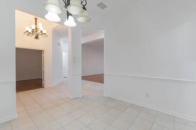 a view of an entryway with chandelier