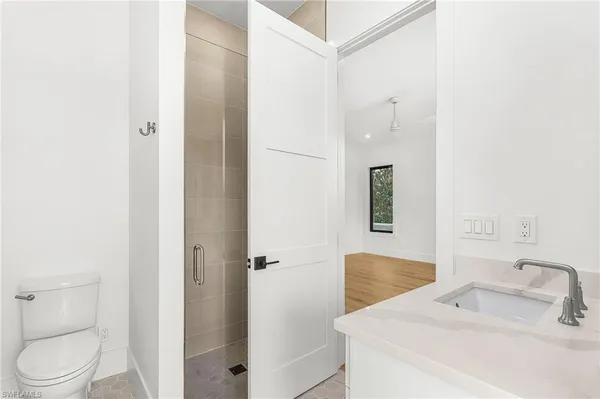 a bathroom with a sink and toilet