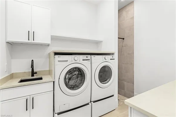 a utility room with dryer and washer