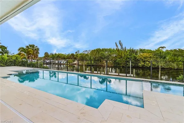 a view of swimming pool with a patio