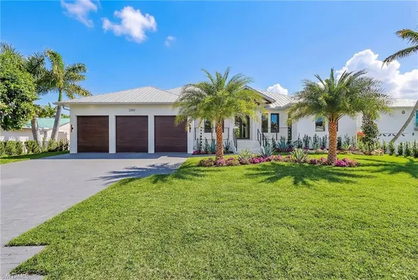 a front view of house with yard and green space