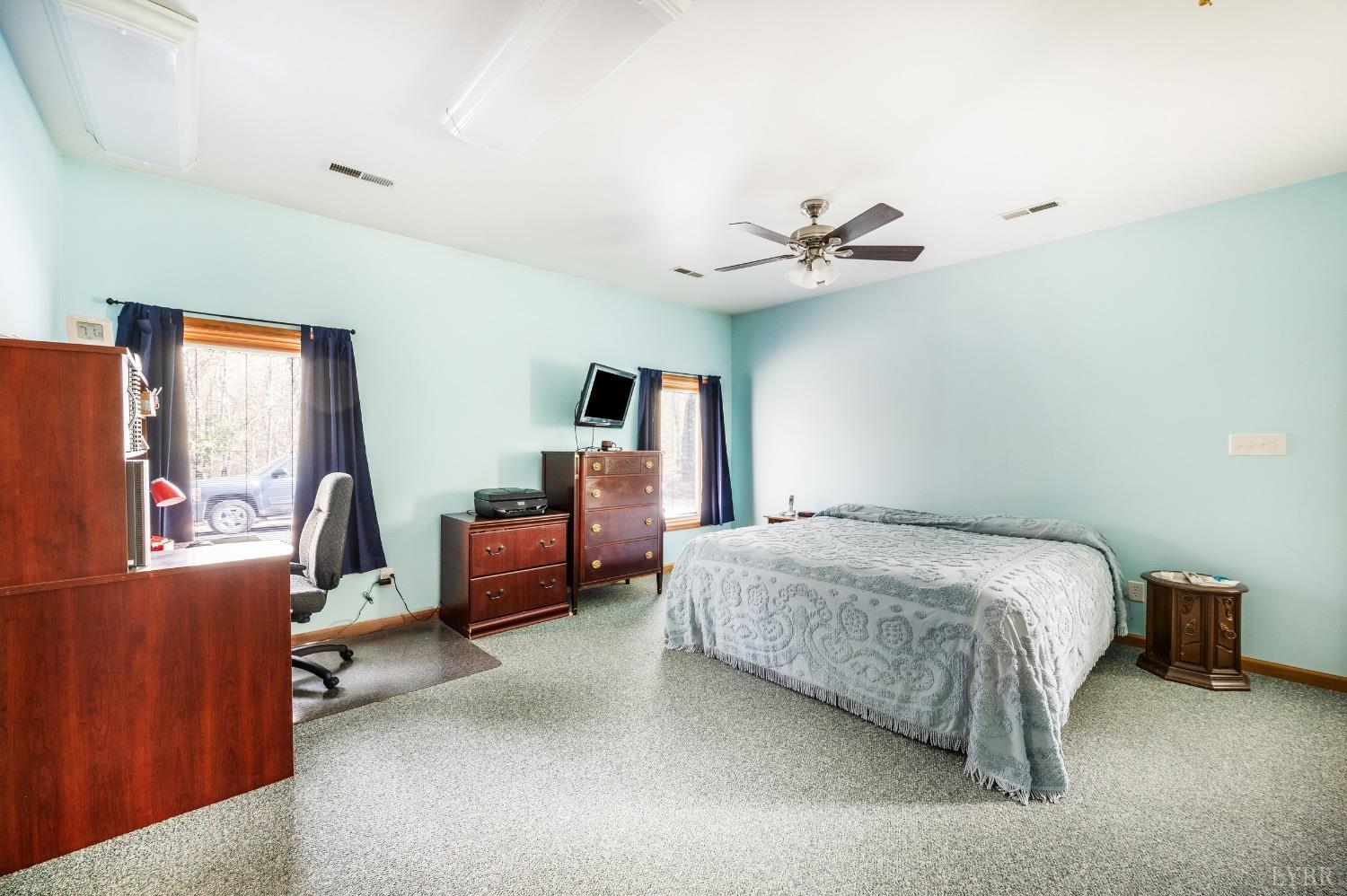 239 Little Farm Road Amherst, VA 24521 - Photo 27 of 59 a bedroom with bed and ceiling fan