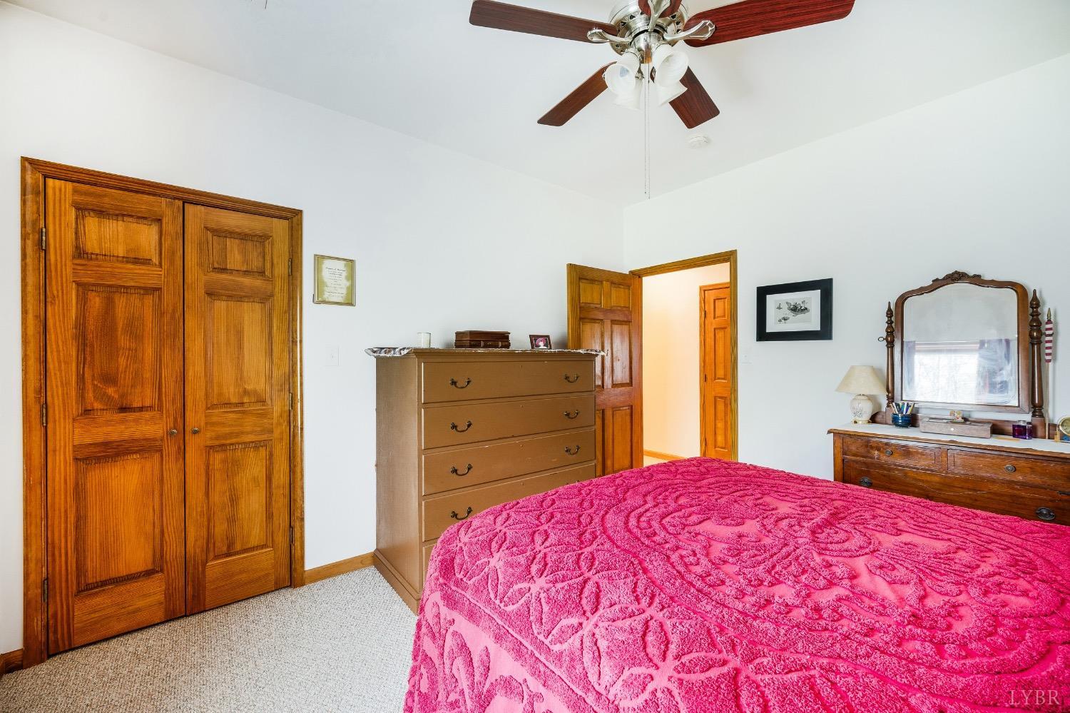 239 Little Farm Road Amherst, VA 24521 - Photo 33 of 59 a bedroom with a bed and a dresser