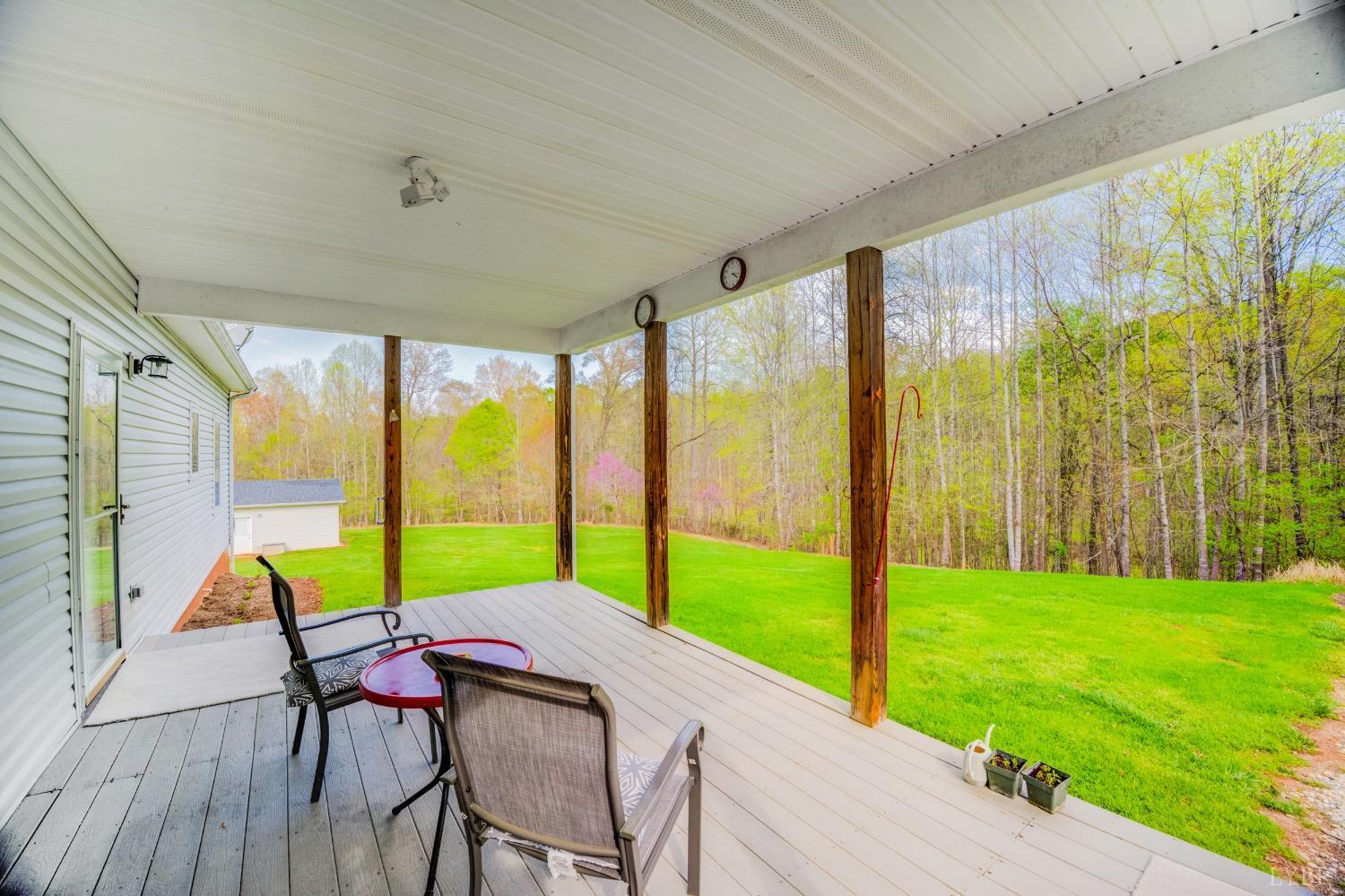 239 Little Farm Road Amherst, VA 24521 - Photo 5 of 59 a view of a chair and table in the patio