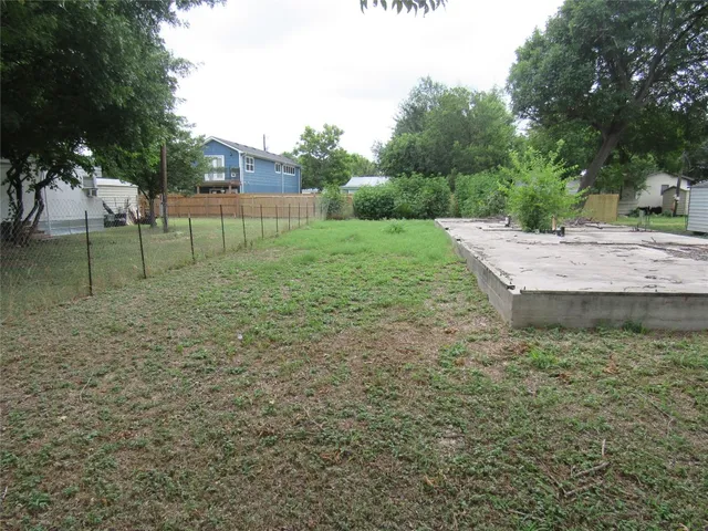 a view of a backyard with trees