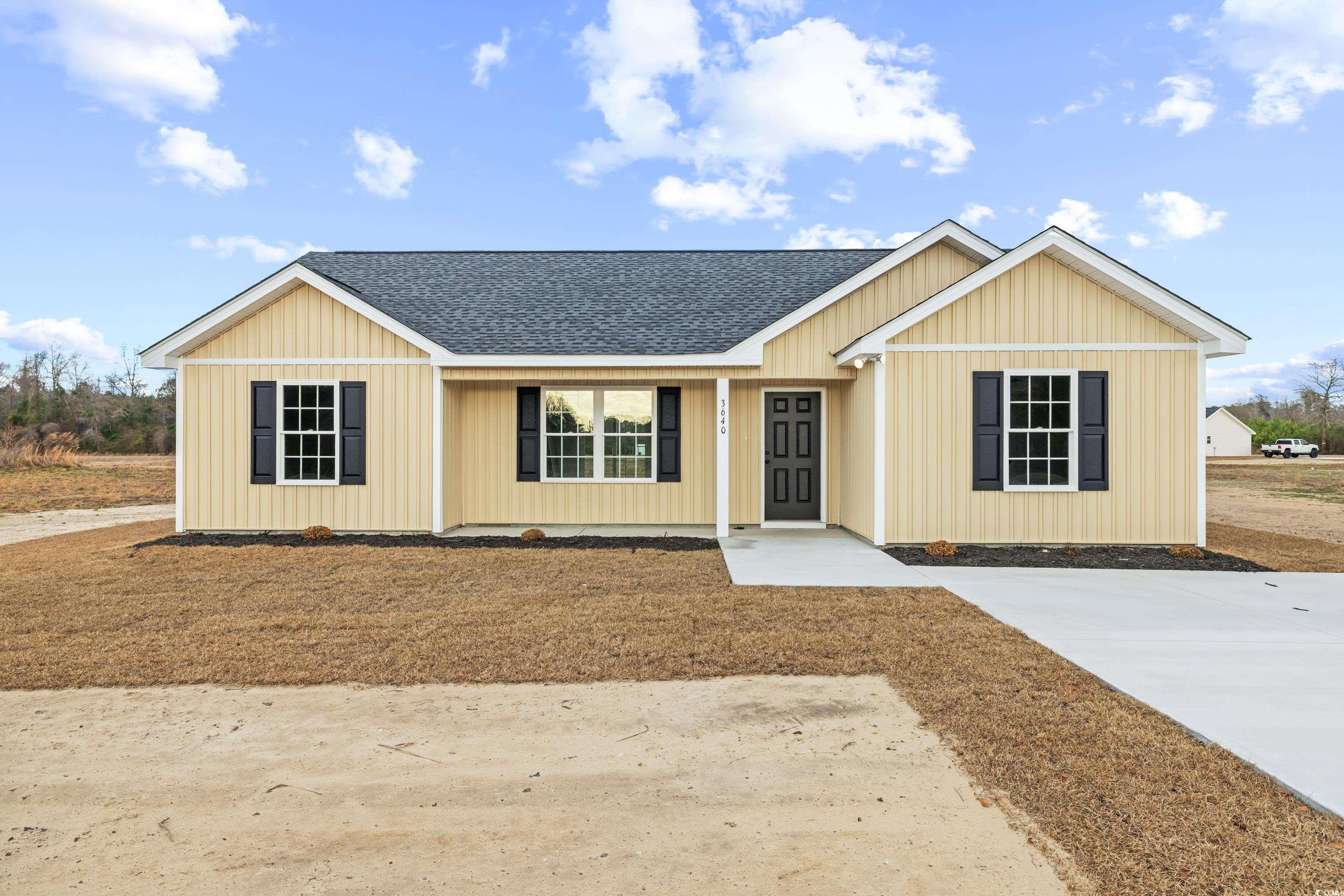 Single story home with a shingled roof and covered porch