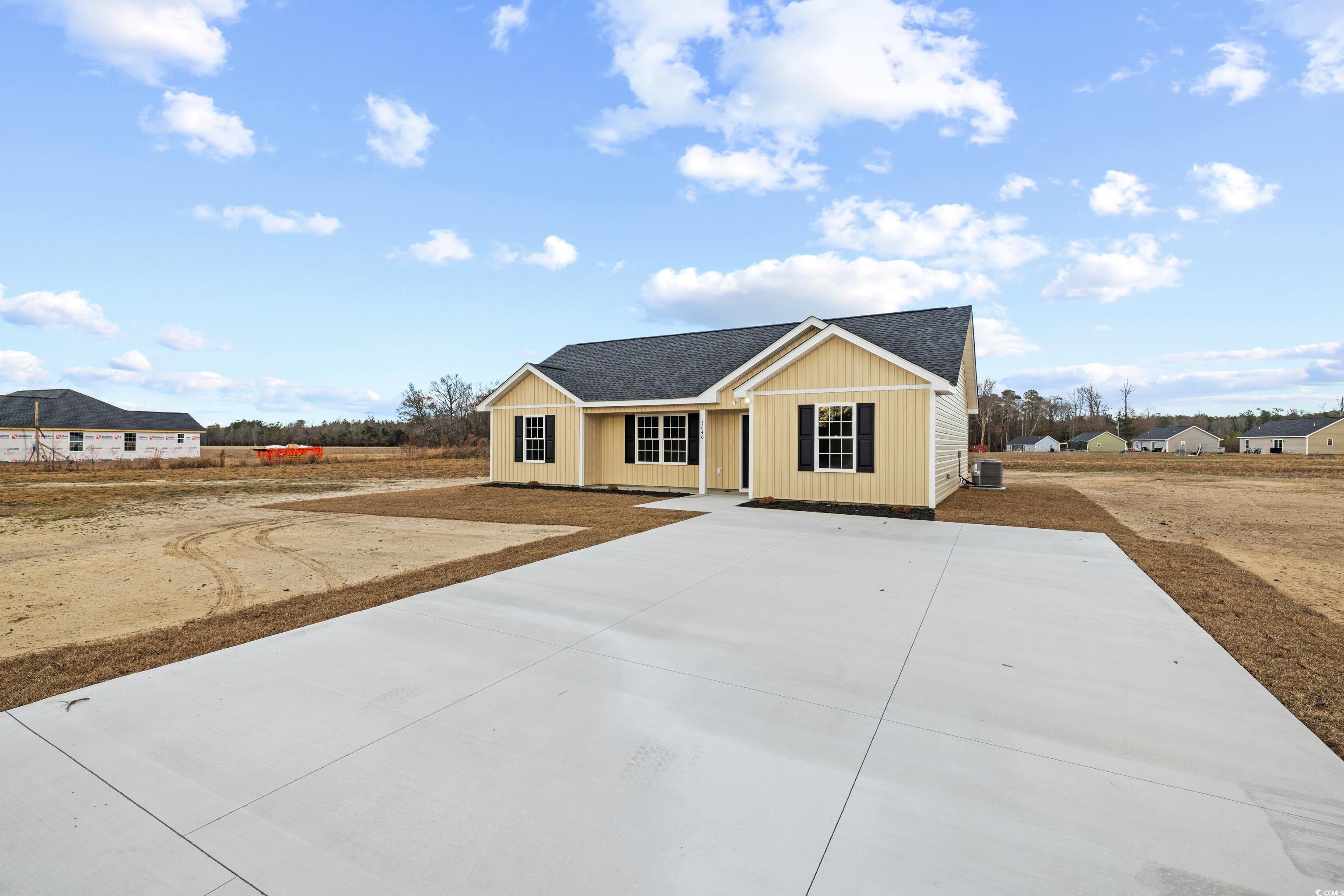 3640 Bethel Chapel Road Loris, SC 29569 - Photo 2 of 35 View of front of house with roof with shingles and concrete driveway