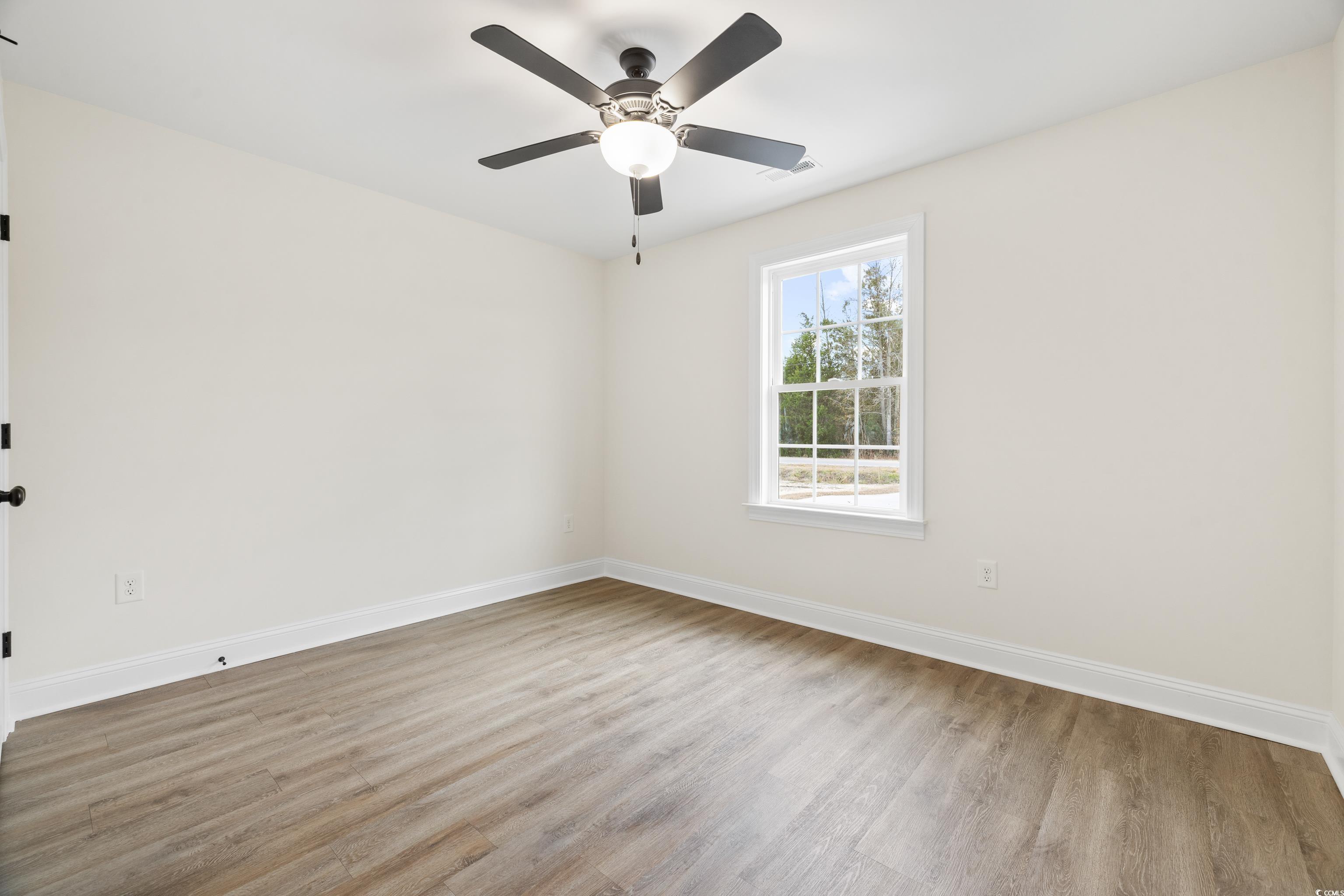 3640 Bethel Chapel Road Loris, SC 29569 - Photo 30 of 35 Spare room featuring light wood-style flooring and a ceiling fan