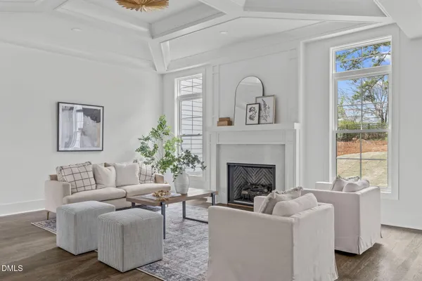 a living room with couches and a fireplace