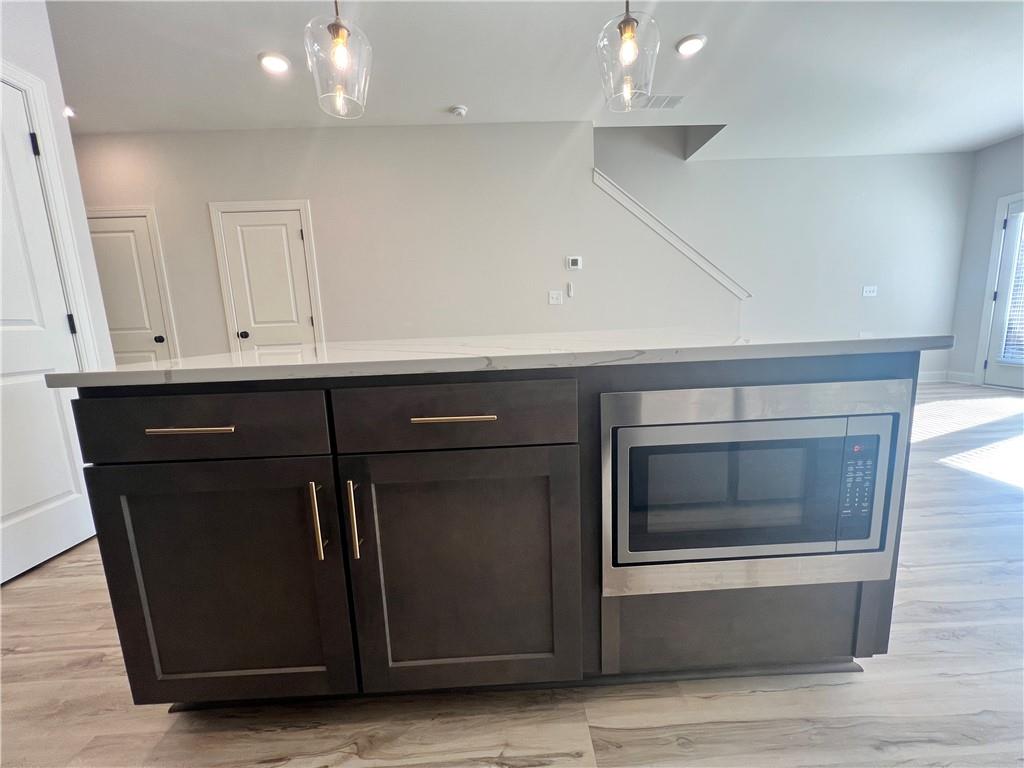 1337 Parc Bench Road Atlanta, GA 30316 - Photo 11 of 35 a kitchen with a stove and a microwave