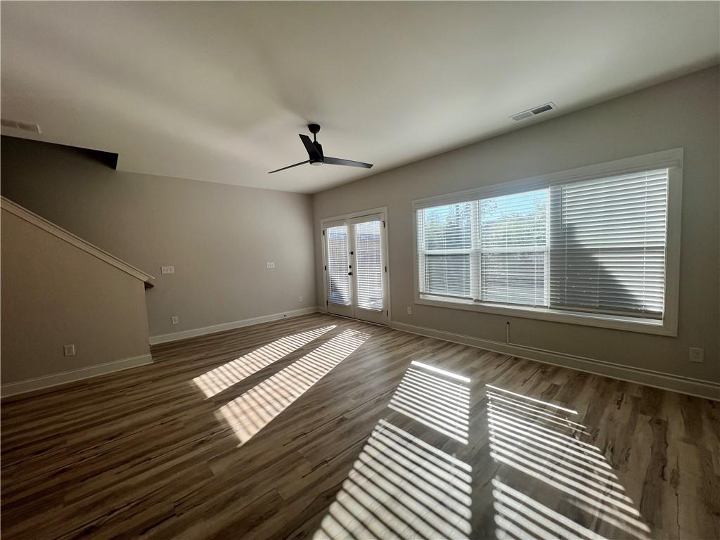 1337 Parc Bench Road Atlanta, GA 30316 - Photo 17 of 35 a view of an empty room with wooden floor and windows