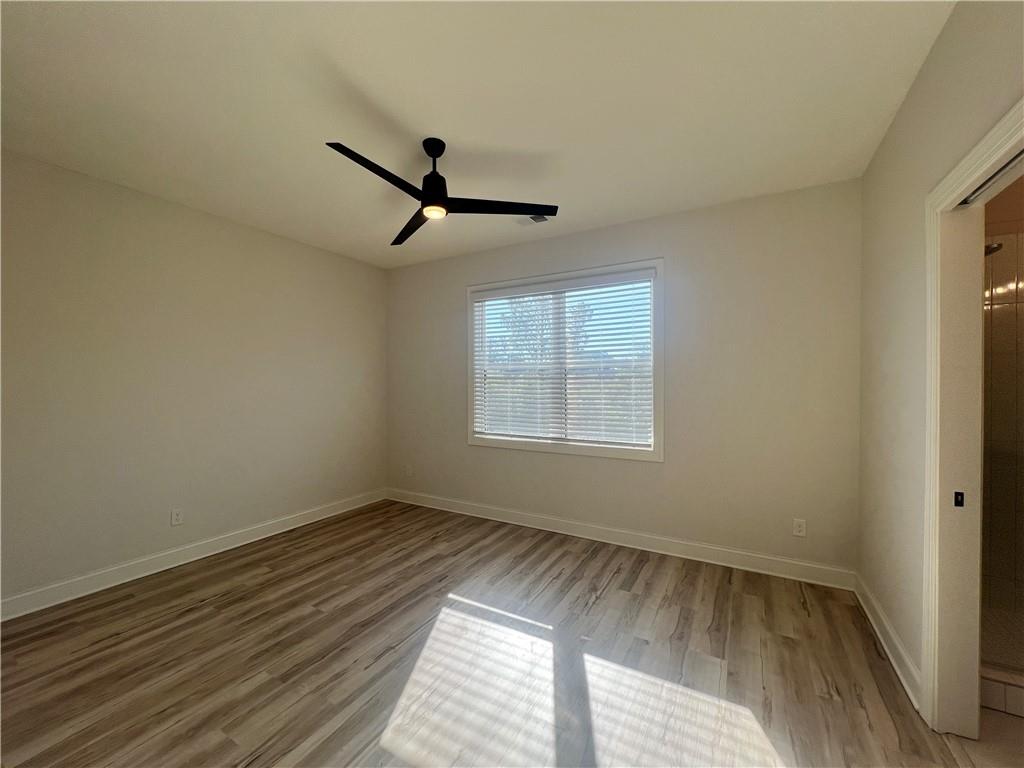 1337 Parc Bench Road Atlanta, GA 30316 - Photo 24 of 35 wooden floor in an empty room with a window