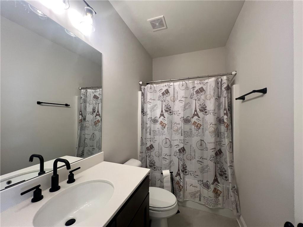 1337 Parc Bench Road Atlanta, GA 30316 - Photo 31 of 35 a bathroom with a sink toilet and shower