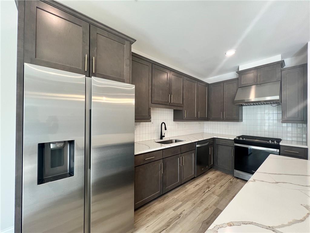 1337 Parc Bench Road Atlanta, GA 30316 - Photo 8 of 35 a kitchen with a sink stainless steel appliances and cabinets