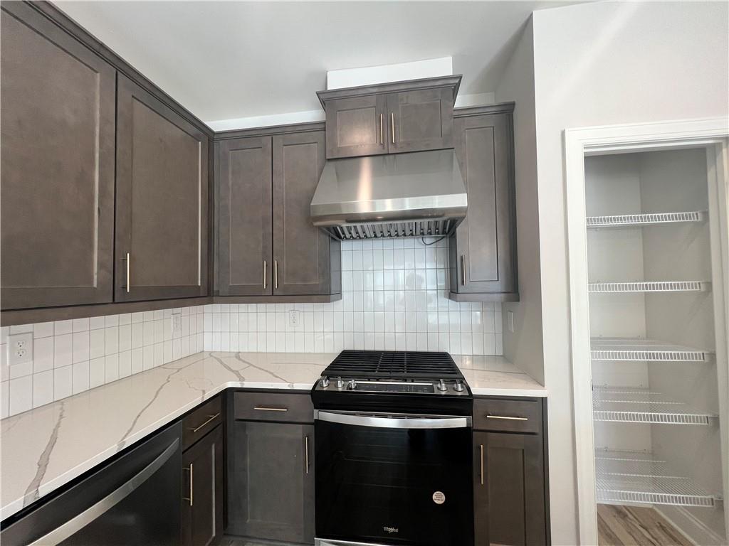 1337 Parc Bench Road Atlanta, GA 30316 - Photo 9 of 35 a kitchen with a stove and a sink