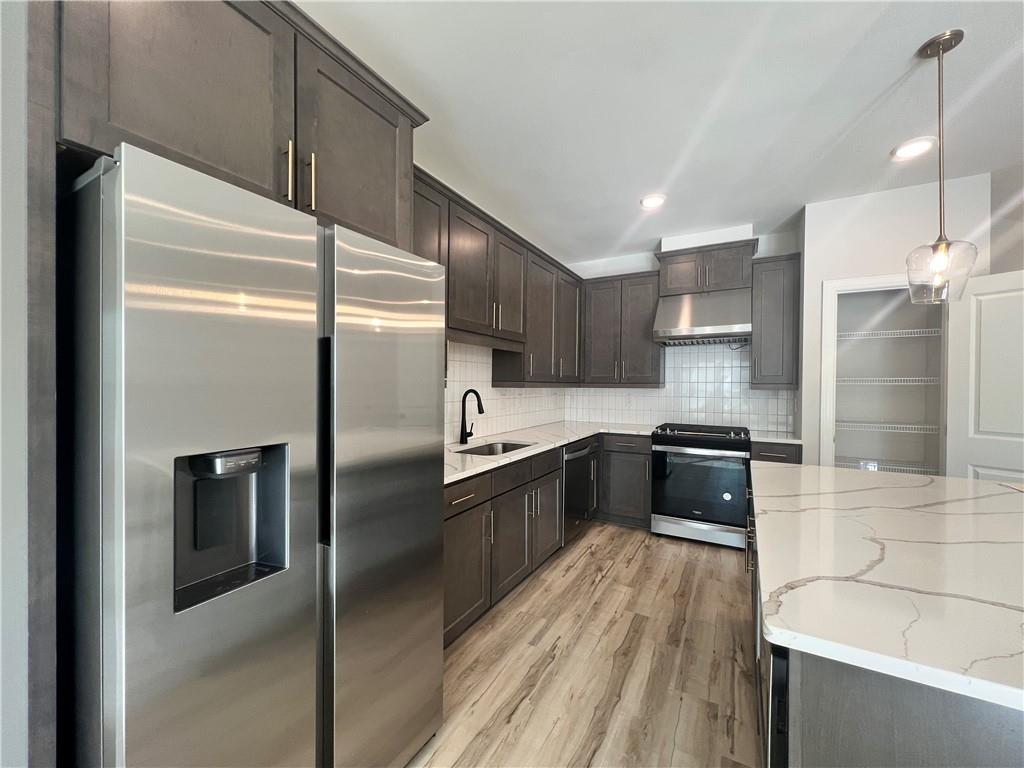 1337 Parc Bench Road Atlanta, GA 30316 - Photo 10 of 35 a large kitchen with a refrigerator a sink and dishwasher