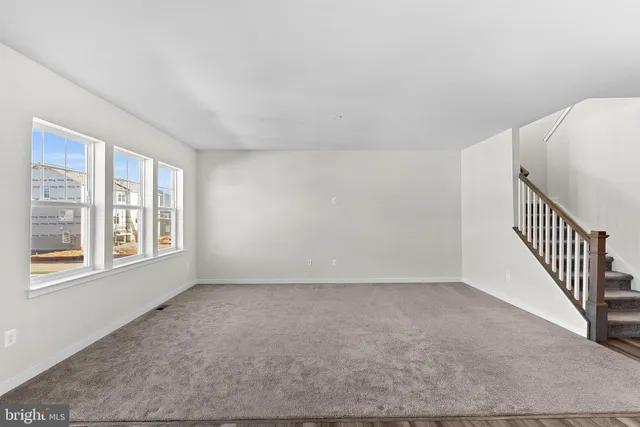 a view of a kitchen with a sink and cabinets