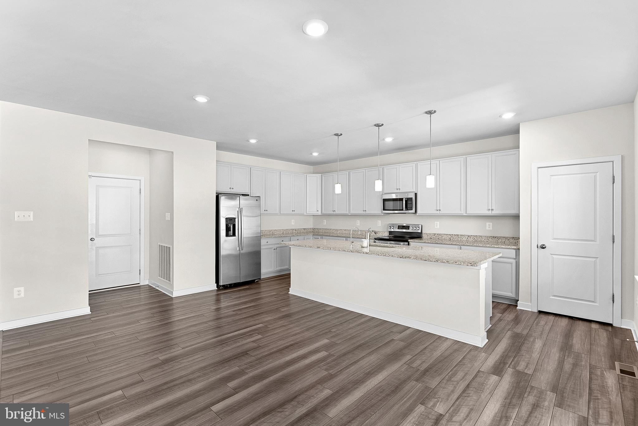 261 Short Br Drive Ranson, WV 25438 - Photo 19 of 71 a large white kitchen with a white stove top oven and refrigerator
