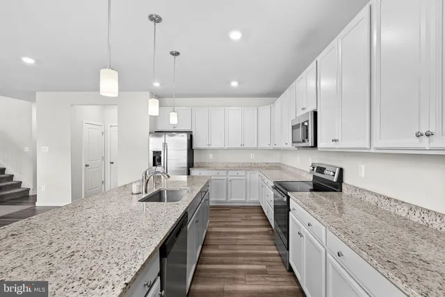 a bathroom with a shower sink and mirror
